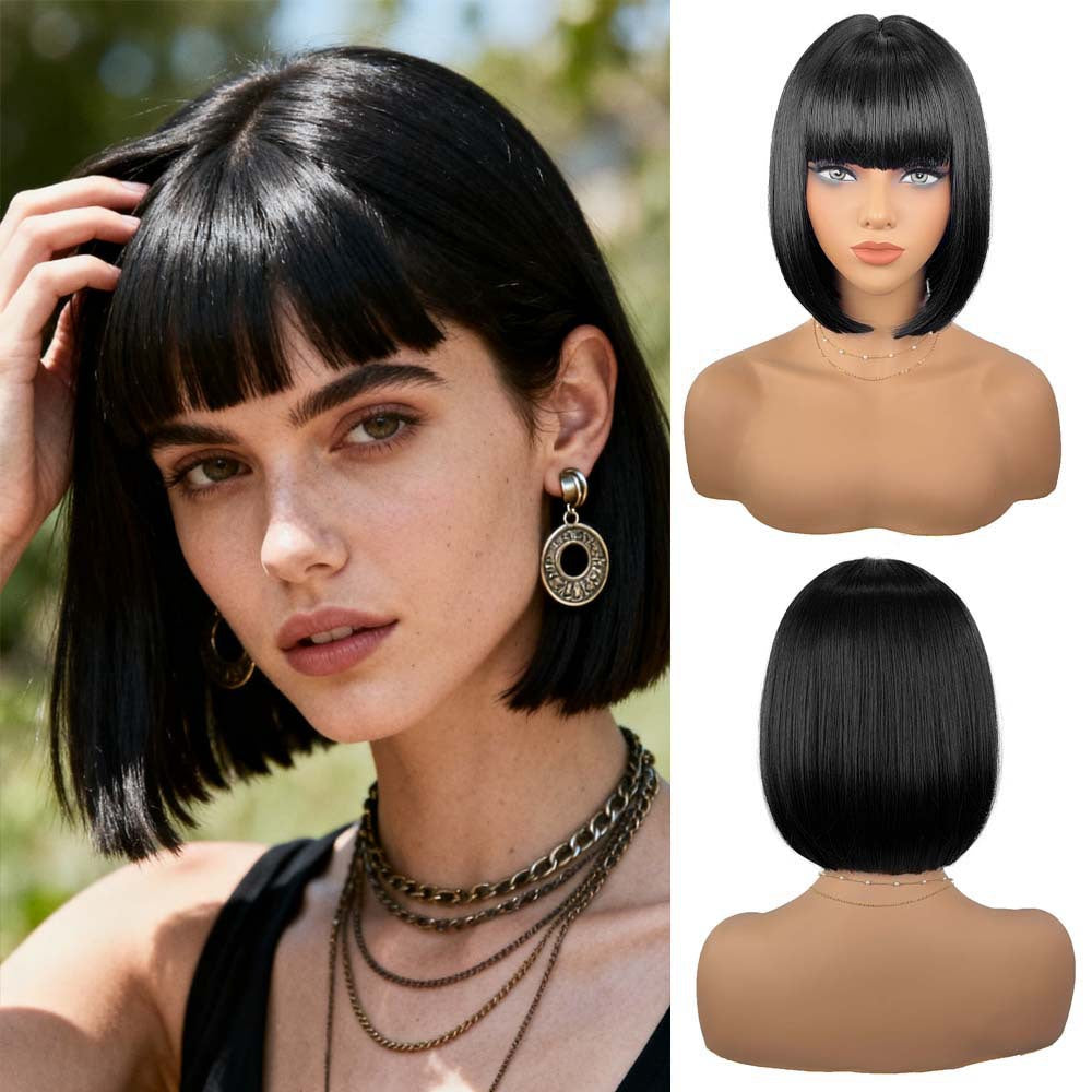 Short black bob wig with bangs on mannequin – front view